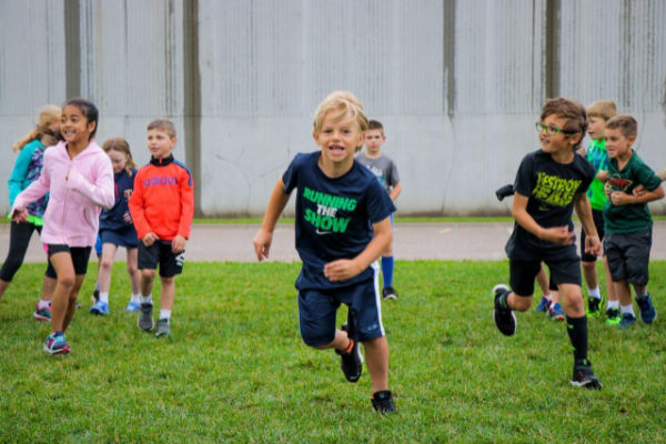 Kids running at an AKAsport Camp