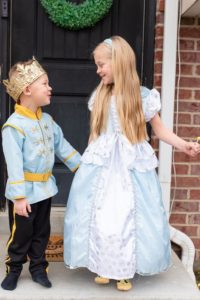 Two children dressed as prince and Cinderella