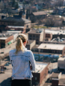 Woman viewing Red Wing Minnesota from the Barn Bluff Overlook