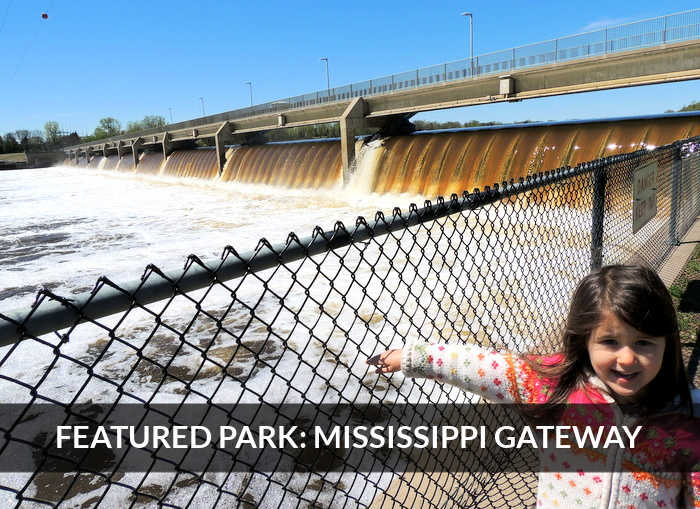 Featured Park: Mississippi Gateway -- Small girl marveling over Coon Rapids Dam at Mississippi Gateway Park