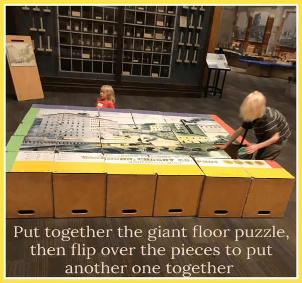 Kids putting together giant puzzle at Mill City Museum in Minneapolis, Minnesota