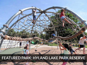 Kids climbing webs at Hyland Lake Park Reserve playground, Bloomington, Minnesota