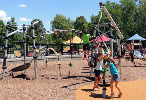 Kids playing on playground in Elm Creek Park in Maple Grove, Minnesota