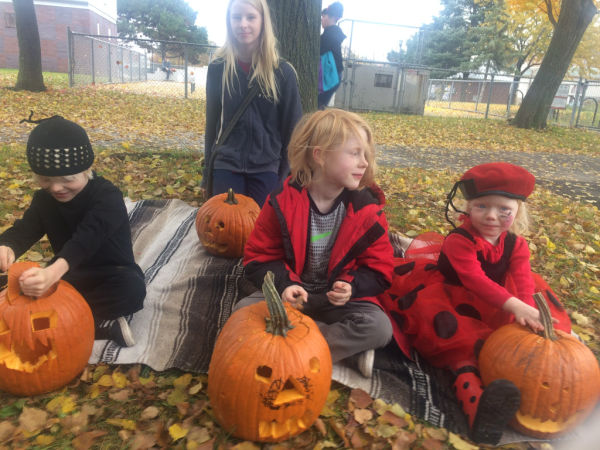 4 Kids with Halloween Pumpkins They Carved at Bottineau Park, Minneapolis, MN