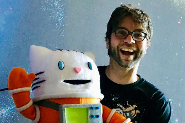 Author Drew Brockington with Waffles the CatStronaut Puppet