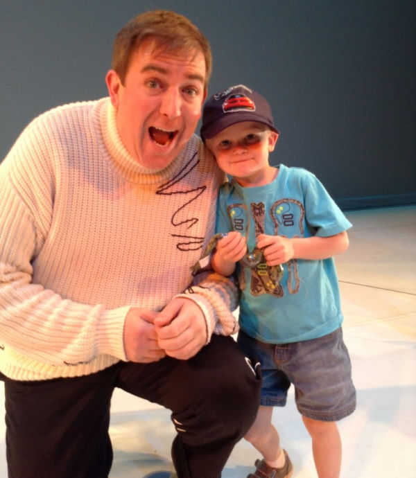Actor Douglas Niethercott poses with boy after performance of The Cat in the Hat at Children's Theatre Company in Minneapolis, MN