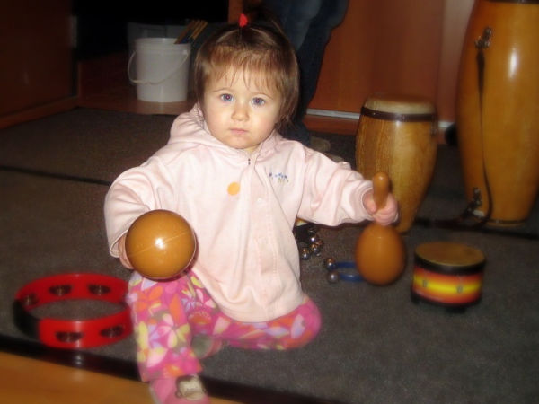 Girl with percussion instruments at a MacPhail Center for Music "Sing, Play, Learn!" event