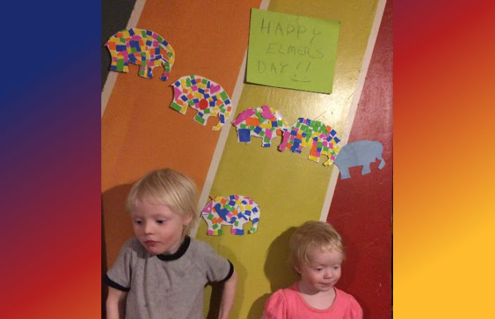 Kids posing by their Elmer's Day Decorations