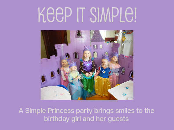 Preschool girls dressed as princesses playing in a purple castle - all smiles.