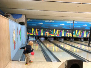 Boy bowling at Elsie's in Northeast Minneapolis, Minnesota