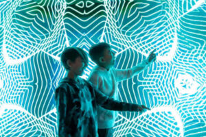 two boys in museum of Illusions kaleidescope
