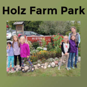 Holz Farm Park - Family standing in front of entrance of Holz Farm in Eagan, Minnesota