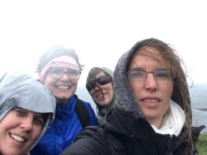 4 wet women on the top of Staffa