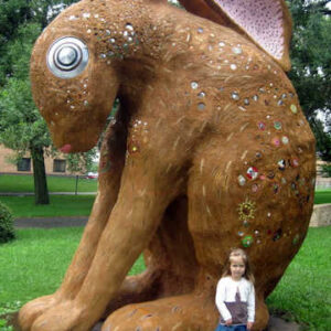 Girl in front of rabbit statue at Western Sculpture Park