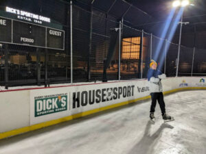 Boy skating on winter outdoor ice rink at Dick’s House of Sport in Minnetonka, MN