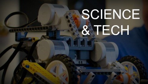 Background is a toy brick robot.. Text: "Science & Tech"