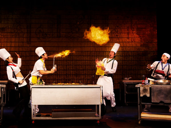 Cookin' Promotional Photo: Three chefs blowing and juggling fire