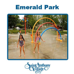 Two girls playing in the splash pad at Emerald Park in St. Anthony Village, MN