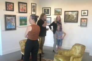 Visitors to Rumriver Art Center viewing Jan Johansen Gallery
