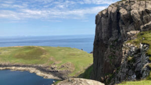 Hikers view of Ruhba Hunish Cliffs on the Isle of Skye, Scotland.
