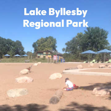 Child playing on beach at Lake Byllesby Regional Park in Cannon Falls, Minnesota