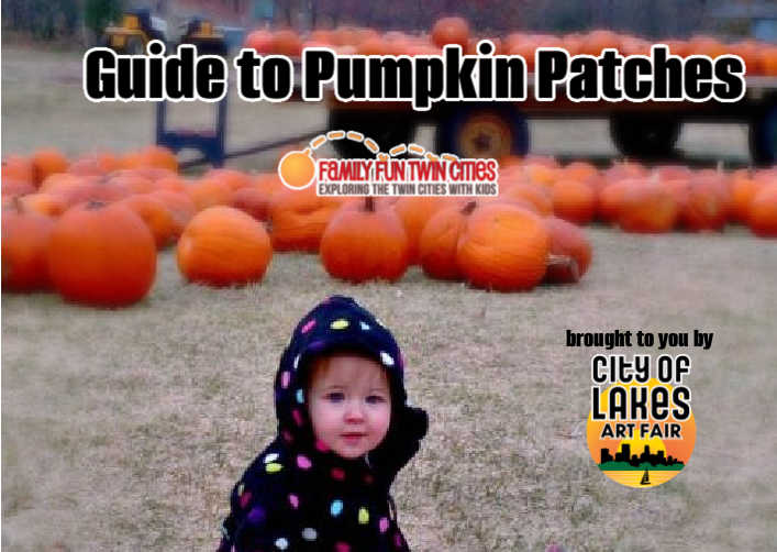 toddler sitting in front of pumpkins